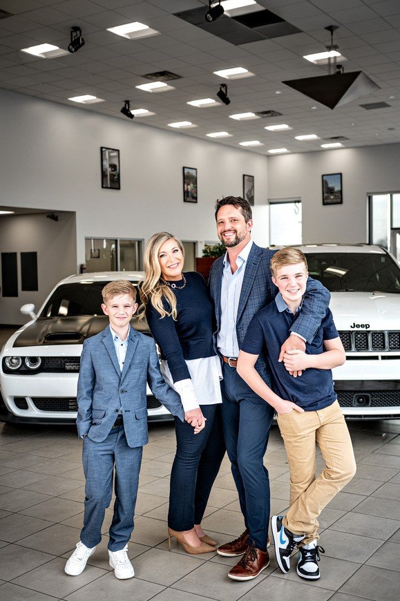 The Pettus family at a Pettus Automotive showroom